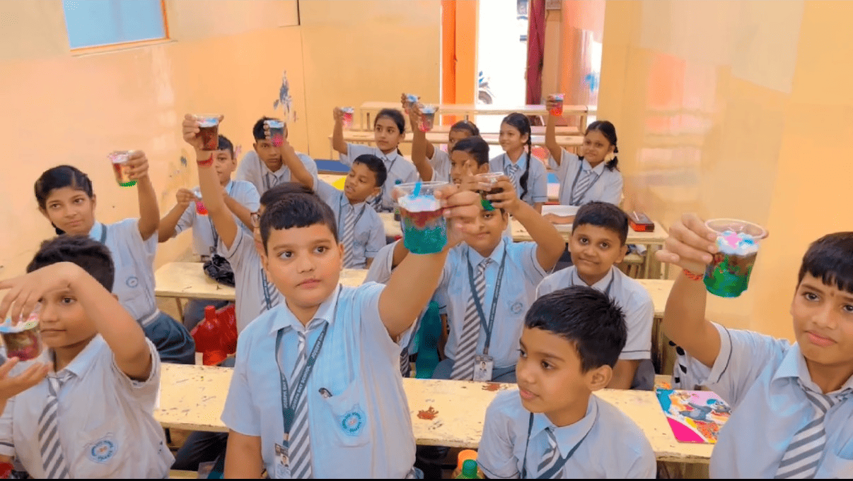 Students showing experiment results